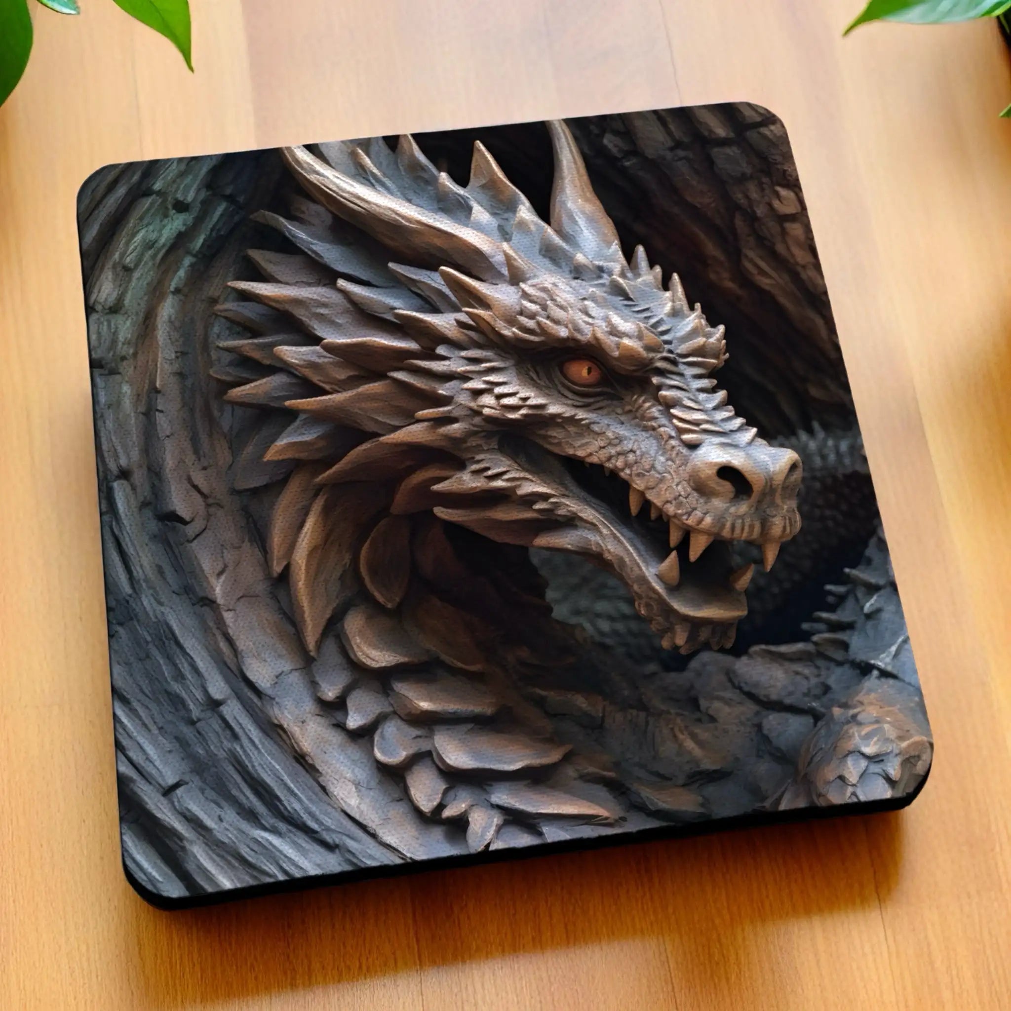 Side view of Mythical Carved Look Dragon neoprene coasters, showcasing a rustic, three-dimensional-effect carved dragon head with fantasy elements against a dark, textured background by Laser Design Creations.