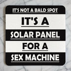 Top view of Not A Bald Spot Solar Panel neoprene coaster with funny bold text about a bald head, by Laser Design Creations.
