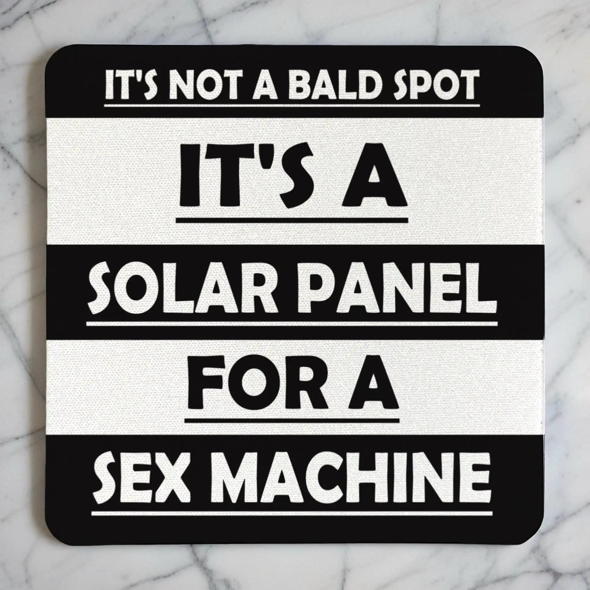 Top view of Not A Bald Spot Solar Panel neoprene coaster with funny bold text about a bald head, by Laser Design Creations.