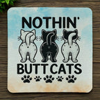 Top view of Funny Cat Butts Watercolor Pawprints neoprene coaster with humorous cat butt silhouettes surrounded by pink and blue watercolor pawprints, by Laser Design Creations.