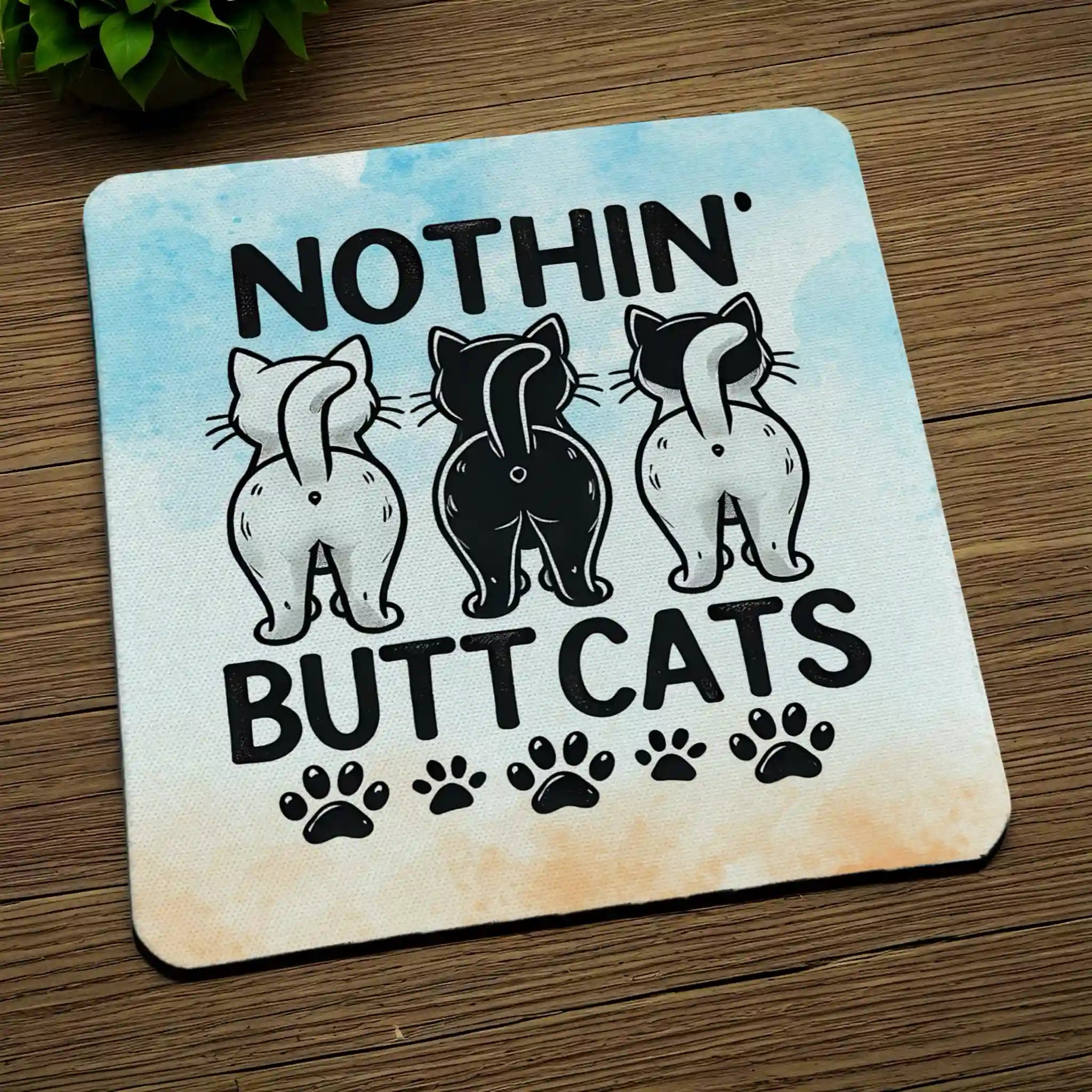 Side view of Nothin' Butt Cats neoprene coaster with the novelty text 'Nothin' Butt Cats' displayed next to watercolour pawprint graphics, by Laser Design Creations.
