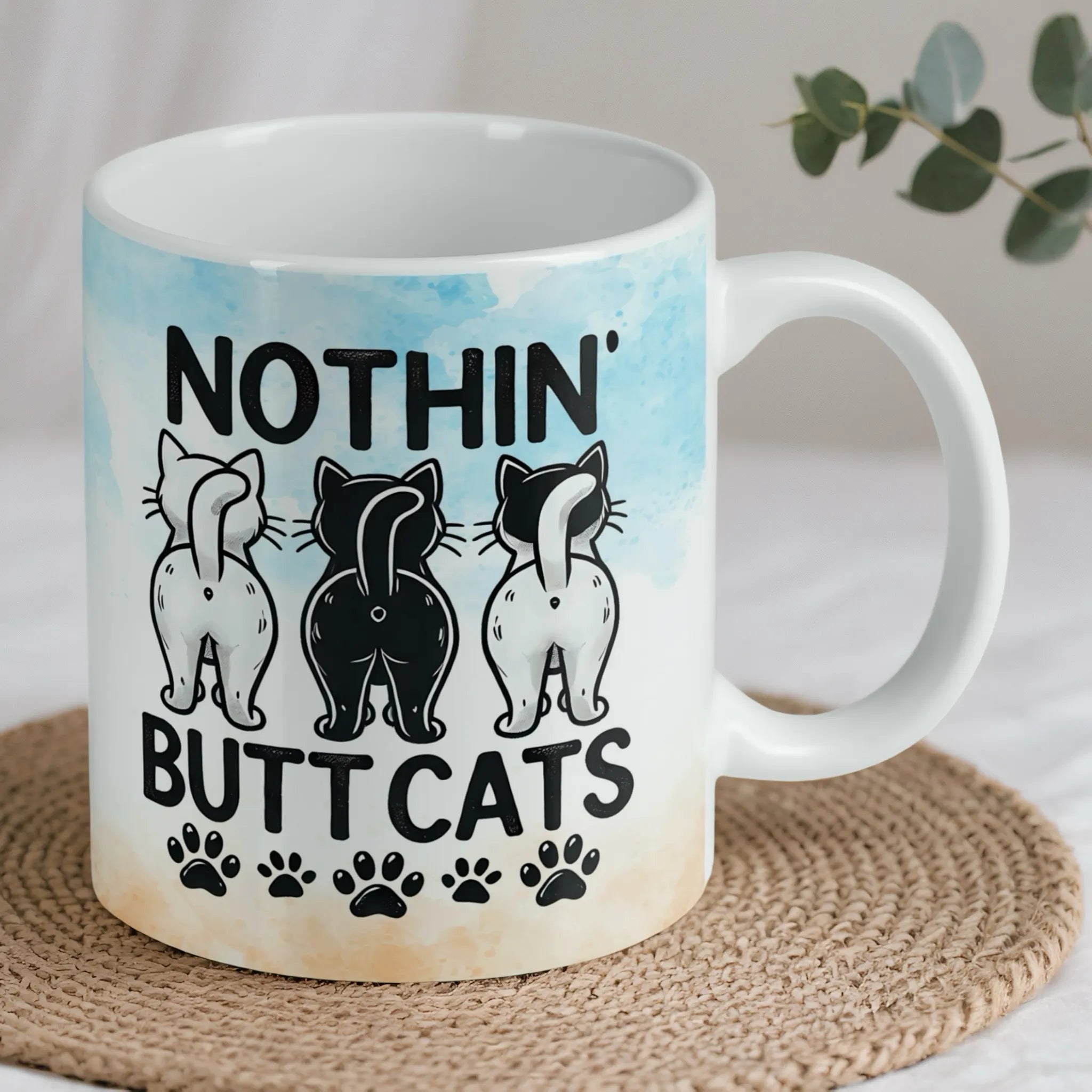 Reverse side of Nothin' Butt Cats mug, showing the playful quote and multiple cheeky feline rear ends by Laser Design Creations.