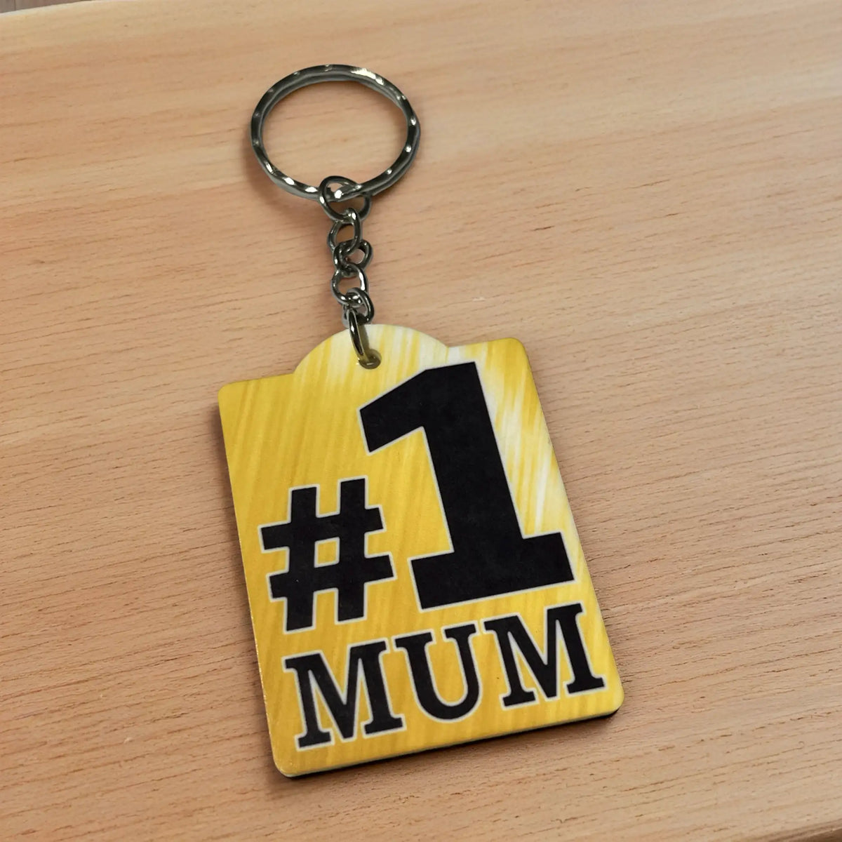 Side view of Number 1 Mum acrylic keyring, showcasing the bold golden textured number one design for parents by Laser Design Creations.