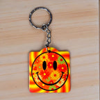 Psychedelic Floral Smiley Face keyring by Laser Design Creations, featuring a fun, retro smiley face graphic surrounded by swirling psychedelic flowers.