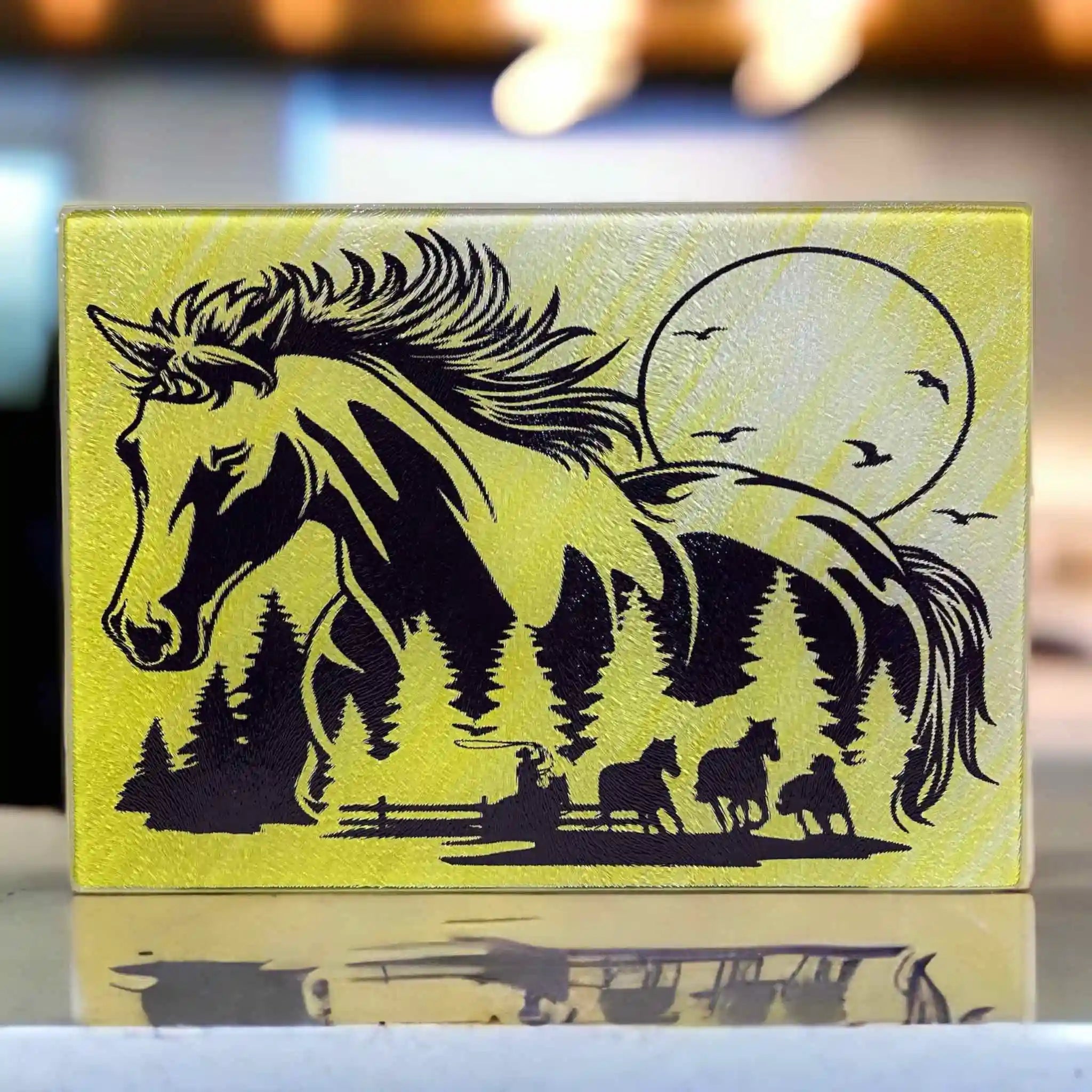 A silhouette of a horse containing a Western cowboy ranch scene chopping board from Laser Design Creations