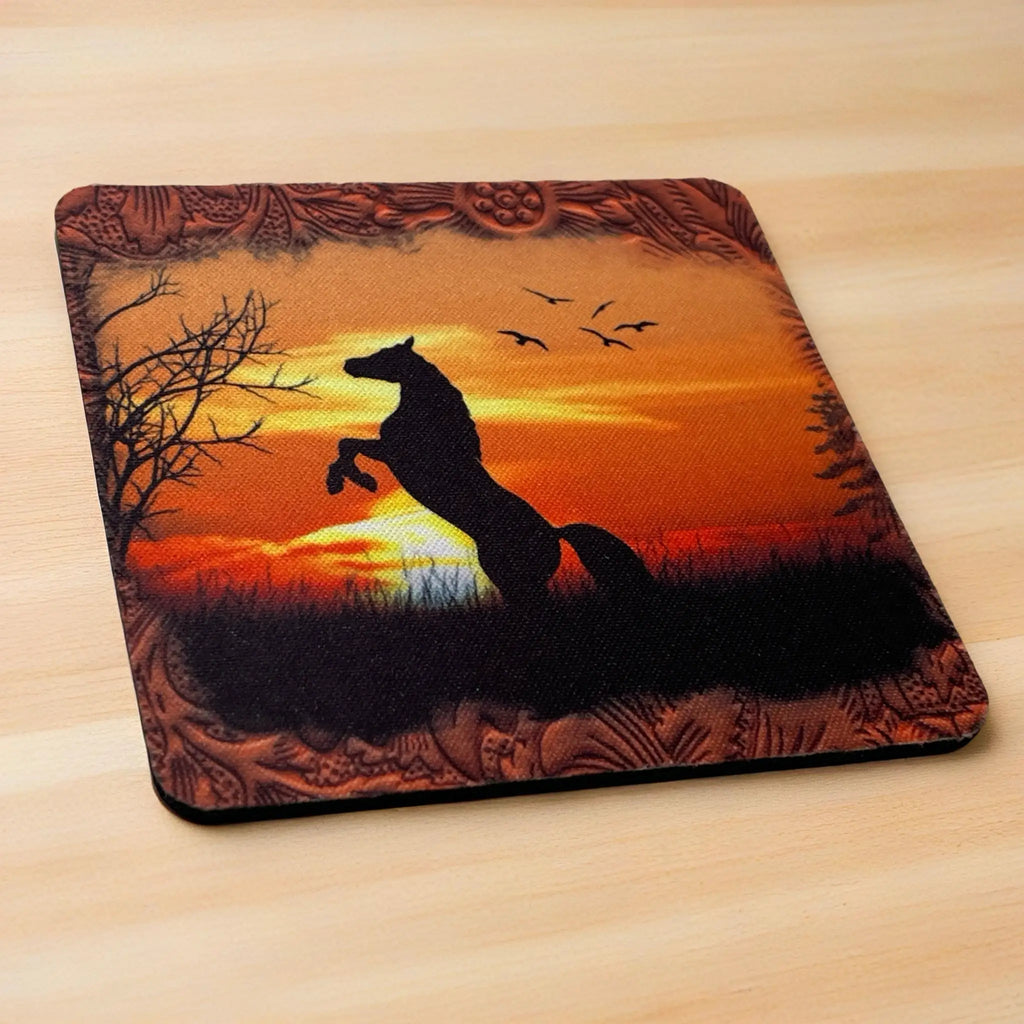 Side view of a set of four Rearing Horse Sunset Silhouette neoprene coasters with a rustic leather-look edge, by Laser Design Creations.