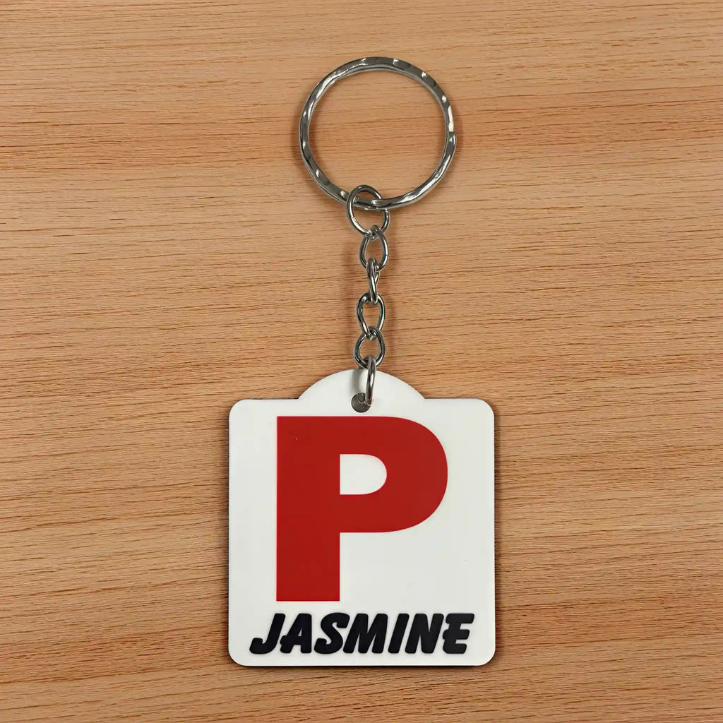 Front view of Personalised Red P Provisional Plate acrylic keyring, showcasing an iconic Australian driving plate design with custom name against a soft neutral background by Laser Design Creations.