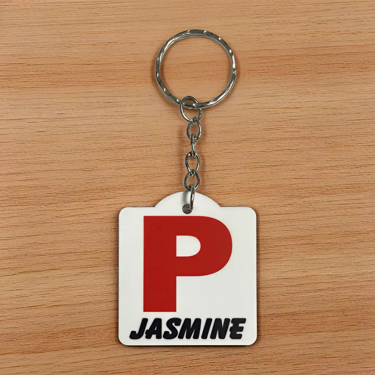 Front view of Personalised Red P Provisional Plate acrylic keyring, showcasing an iconic Australian driving plate design with custom name against a soft neutral background by Laser Design Creations.