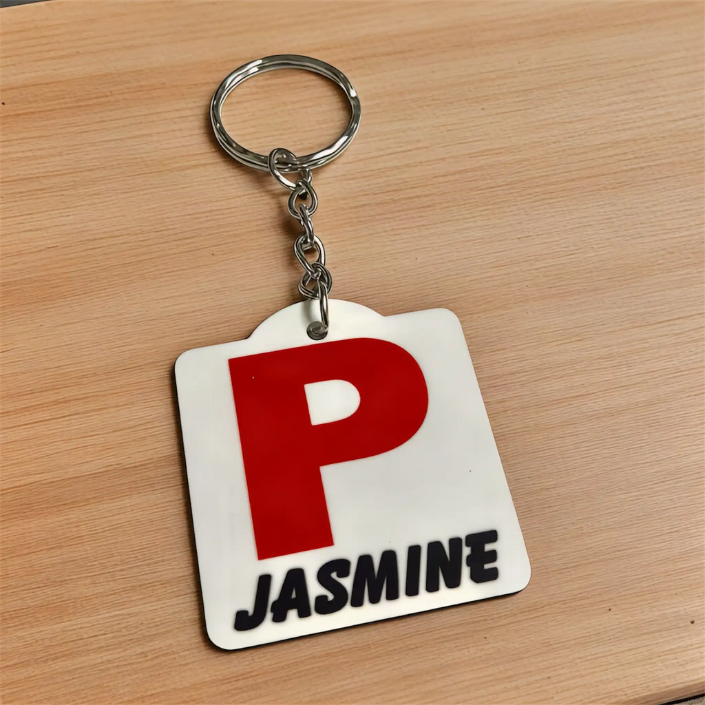 Side view of Personalised Red P Provisional Plate acrylic keyring, showcasing an iconic Australian driving plate design with custom name against a soft neutral background by Laser Design Creations.