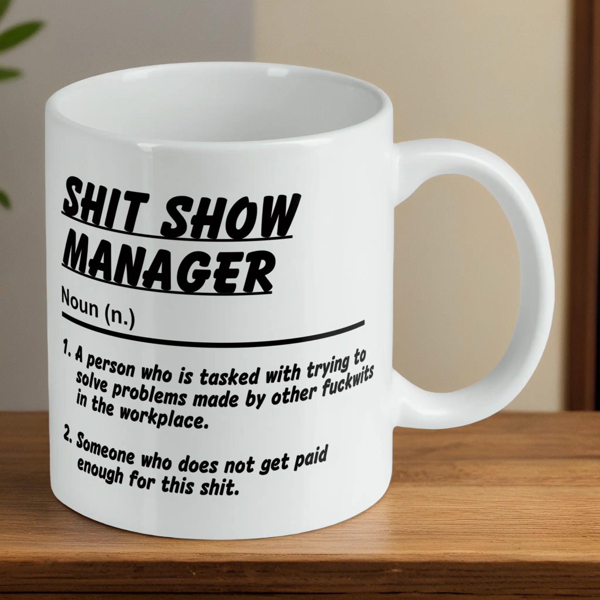 Reverse side of a Shit Show Manager mug, showcasing the sarcastic office humour quote by Laser Design Creations.