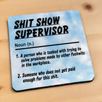 Side view of a Shit Show Supervisor neoprene coaster displaying the humorous definition, by Laser Design Creations.
