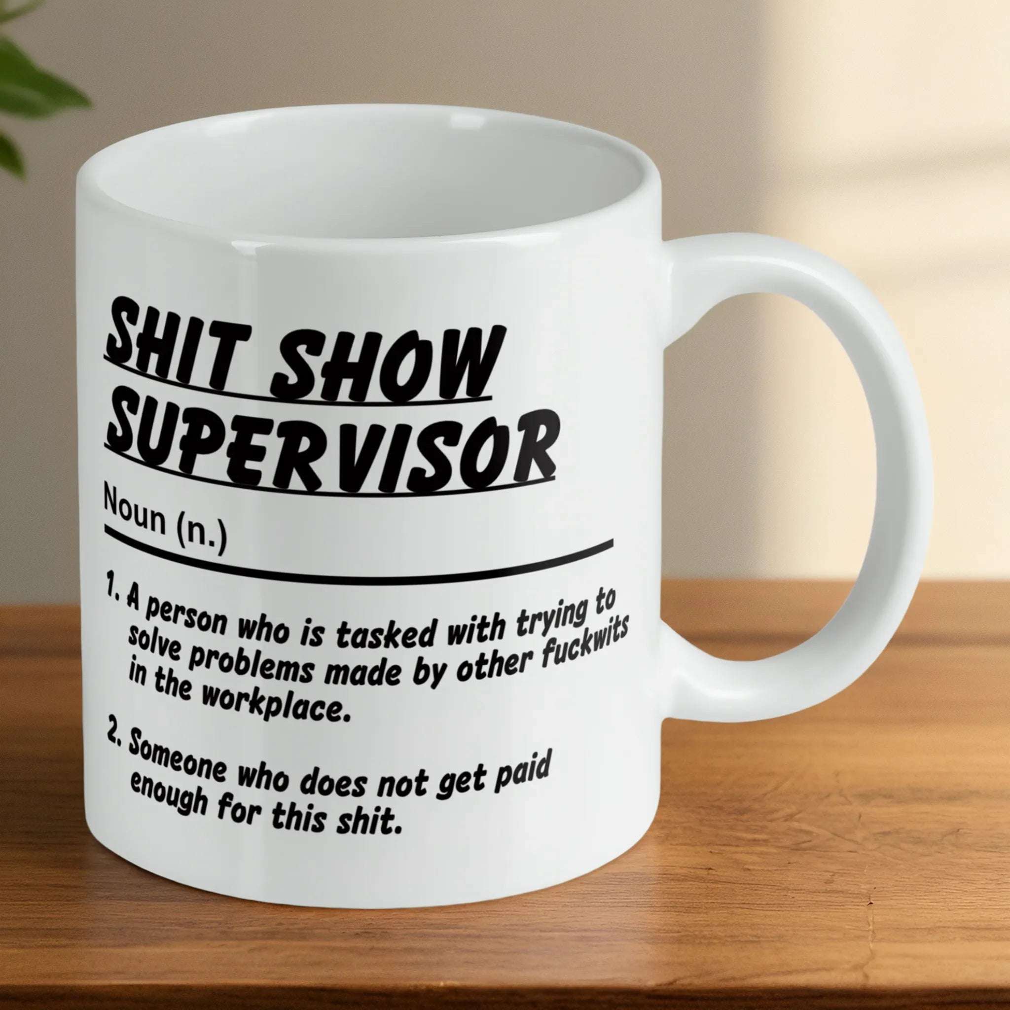 Reverse side of a Shit Show Supervisor mug, showcasing the sarcastic office humour quote by Laser Design Creations.