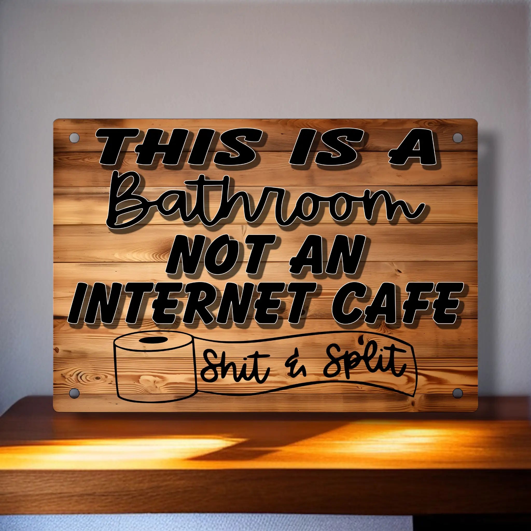 Funny bathroom sign with the quote 'This is a bathroom not an internet cafe, Shit & Split' on a wood-effect background from Laser Design Creations