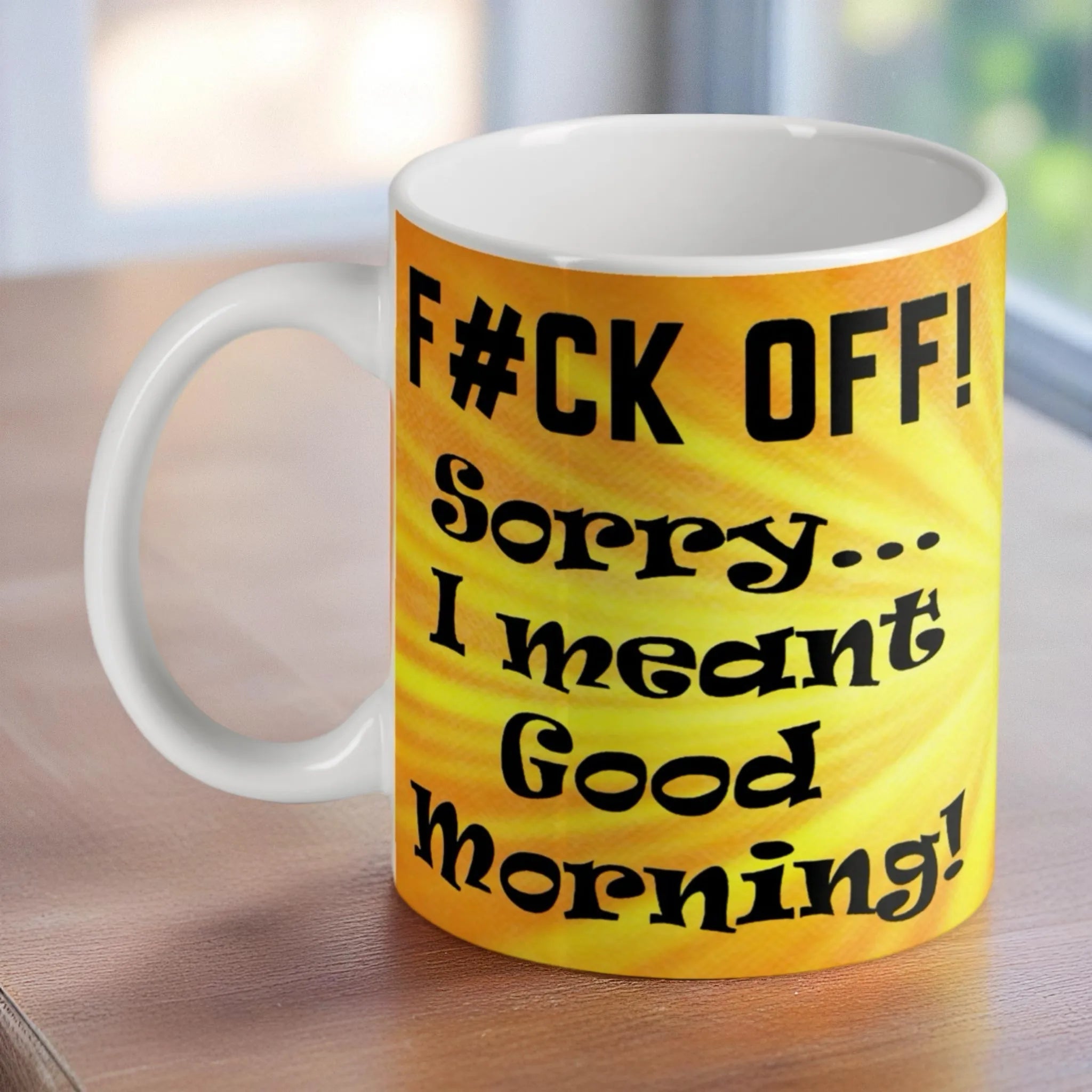 'F*ck Off Good Morning' ceramic mug by Laser Design Creations, featuring a sarcastic quote on a sunburst background.