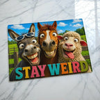 Stay Weird goofy farm animals glass chopping board by Laser Design Creations, featuring a vibrant 3D cartoon donkey, horse, and sheep with the text STAY WEIRD.