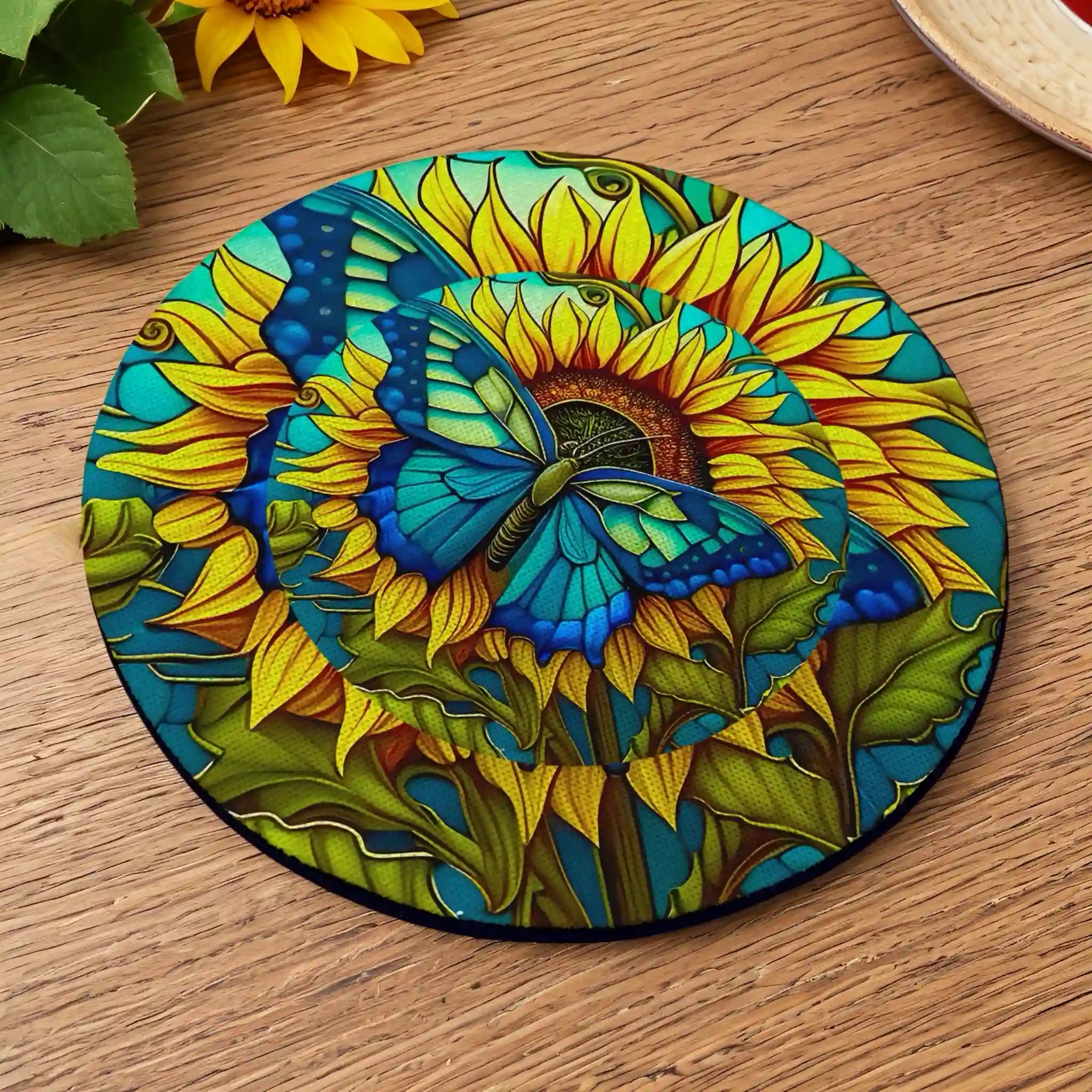 Side view of Blue Butterfly Sunflower Stained Glass neoprene coasters, showcasing a vibrant stained glass style blue butterfly resting on a bright yellow sunflower with a colourful leaded glass background by Laser Design Creations.