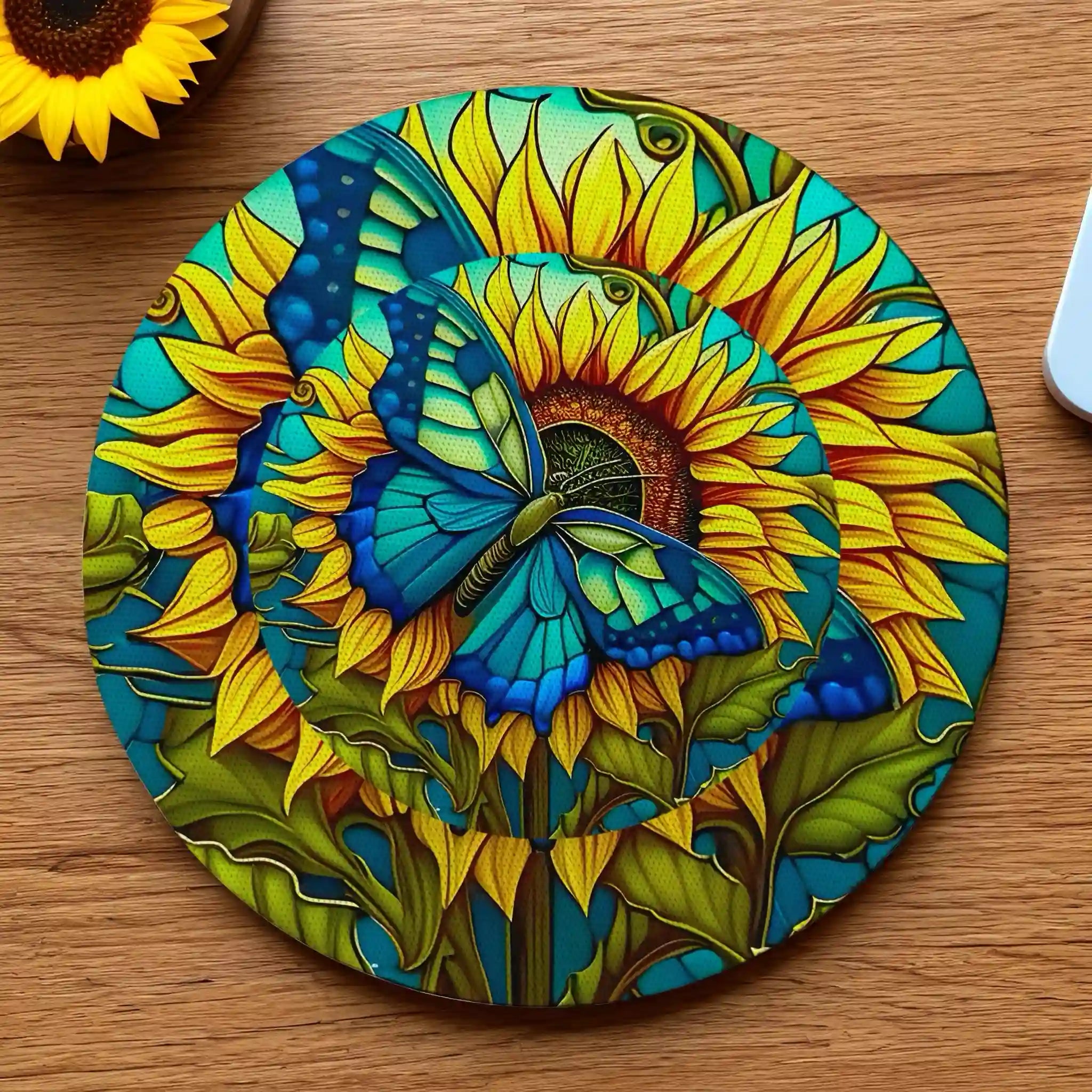 Blue Butterfly Sunflower Stained Glass neoprene coasters by Laser Design Creations, featuring a colourful stained glass design of a blue butterfly perched on a vibrant yellow sunflower.