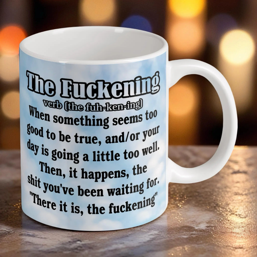 Reverse side of The F*ckening Definition Blue Sky mug, showing the humorous dictionary definition of the word F*ckening against a beautiful blue sky scene by Laser Design Creations.