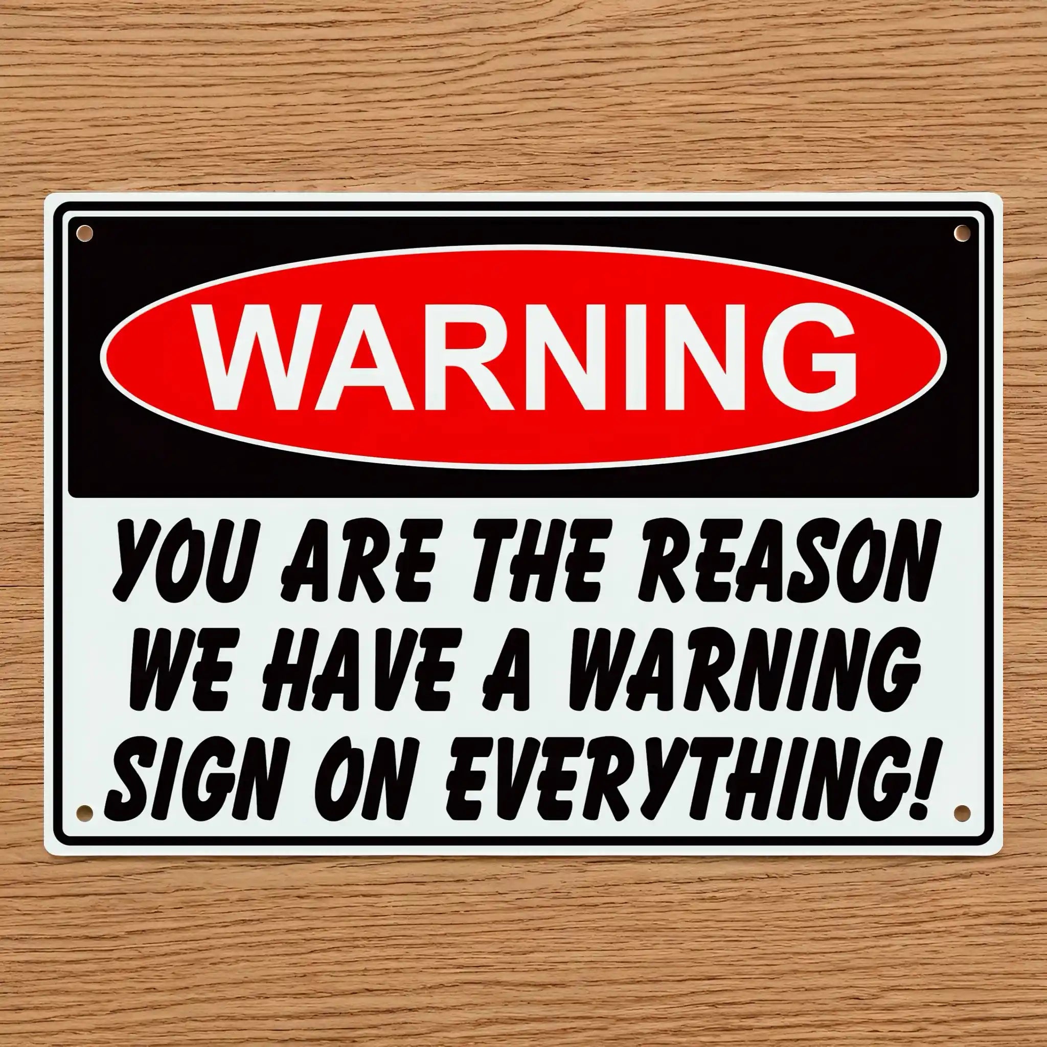 The Reason We Have Warning Signs Novelty Sign Aluminium Sign by Laser Design Creations, featuring the humorous quote "WARNING YOU ARE THE REASON WE HAVE A WARNING SIGN ON EVERYTHING!" in a bold, high-contrast, industrial style.