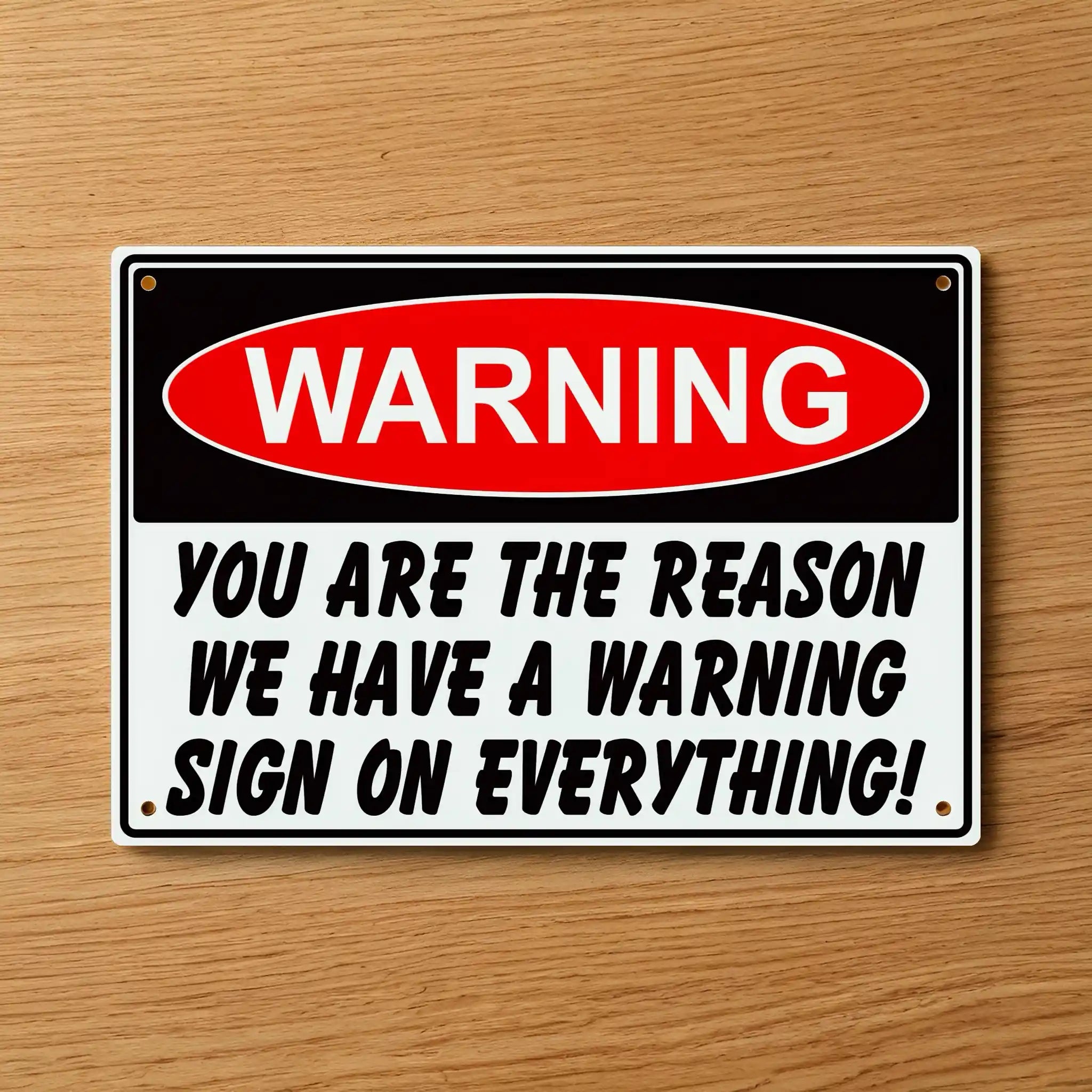 Brilliant Humour Gift Aluminium Sign by Laser Design Creations, featuring a bold design with the witty text: "WARNING YOU ARE THE REASON WE HAVE A WARNING SIGN ON EVERYTHING!", perfect for office jokesters.