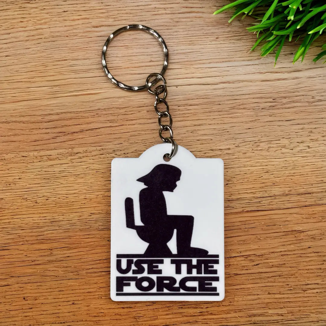 Use The Force Toilet Silhouette keyring by Laser Design Creations, featuring a funny pop culture parody graphic with a toilet silhouette and the text USE THE FORCE.