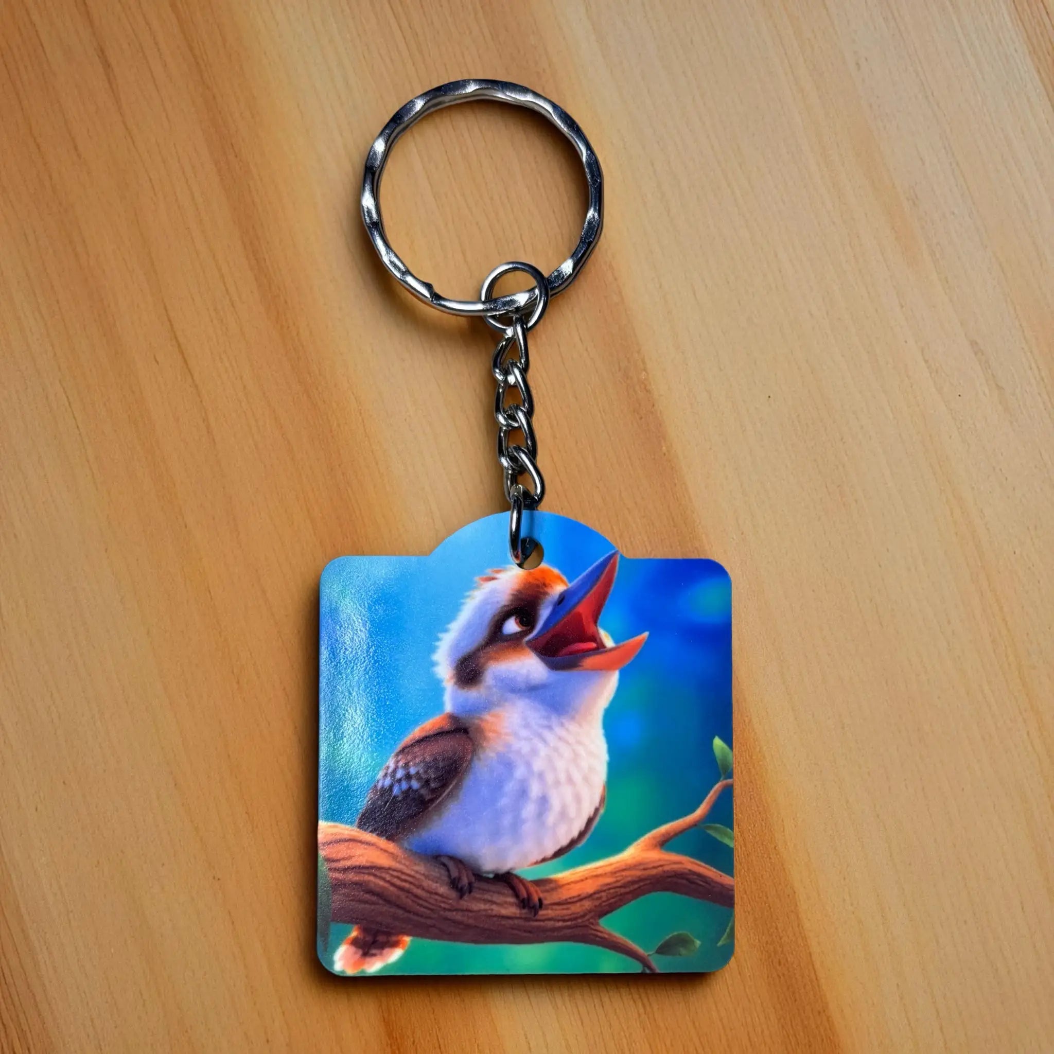 Vibrant Kookaburra on Branch Acrylic Keyring by Laser Design Creations, featuring a charming, laughing kookaburra illustration perched on a branch.