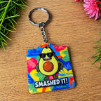 Side view of the Vibrant SMASHED IT! acrylic keyring, showcasing a funny pop art avocado wearing sunnies and the text 'SMASHED IT!' by Laser Design Creations.