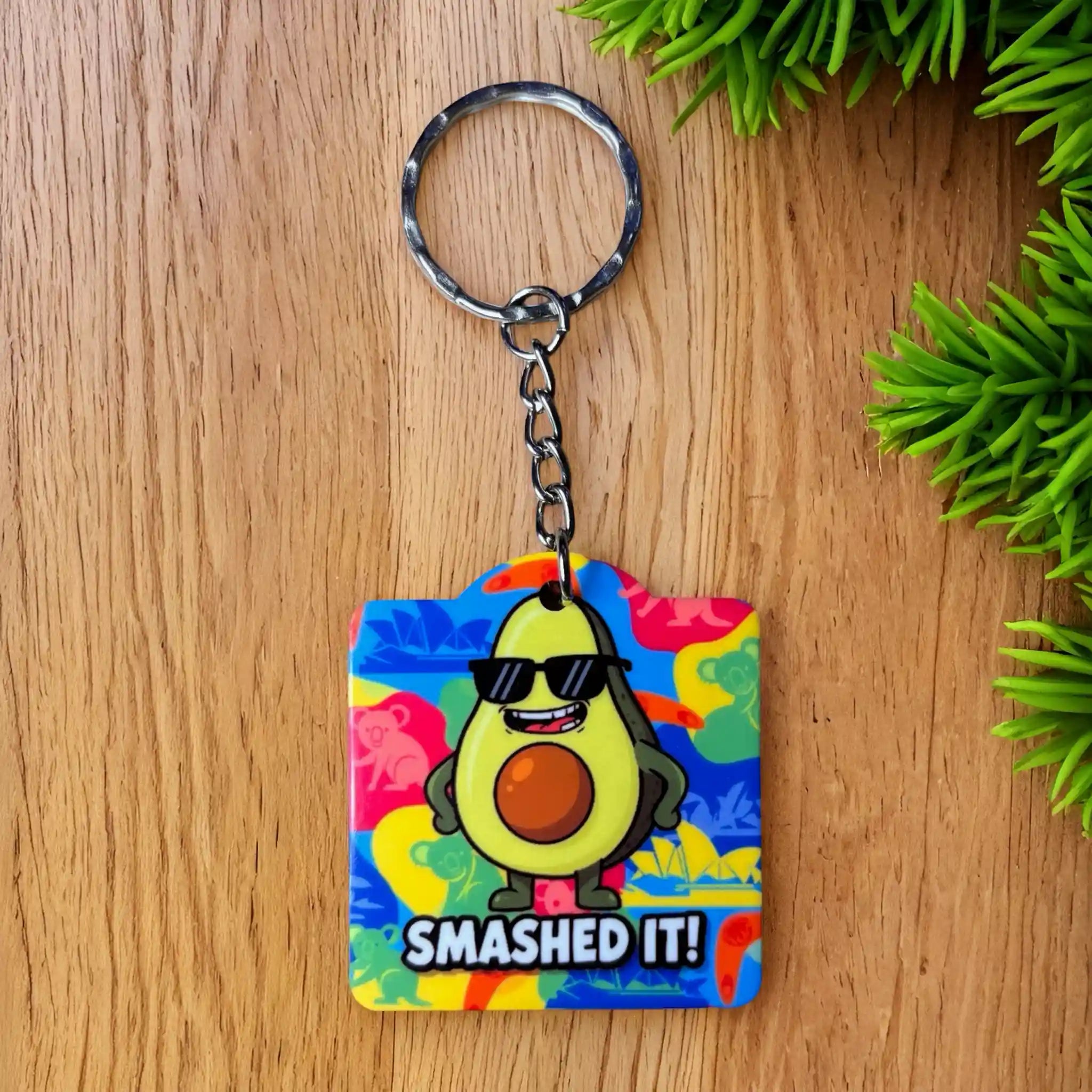 Vibrant SMASHED IT! Keyring by Laser Design Creations, featuring a cool, triumphant avocado cartoon celebrating success.
