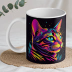 Neon Profile Cat ceramic mug by Laser Design Creations, featuring a stylised cat in a three-quarter profile view with bold pink and yellow tones.