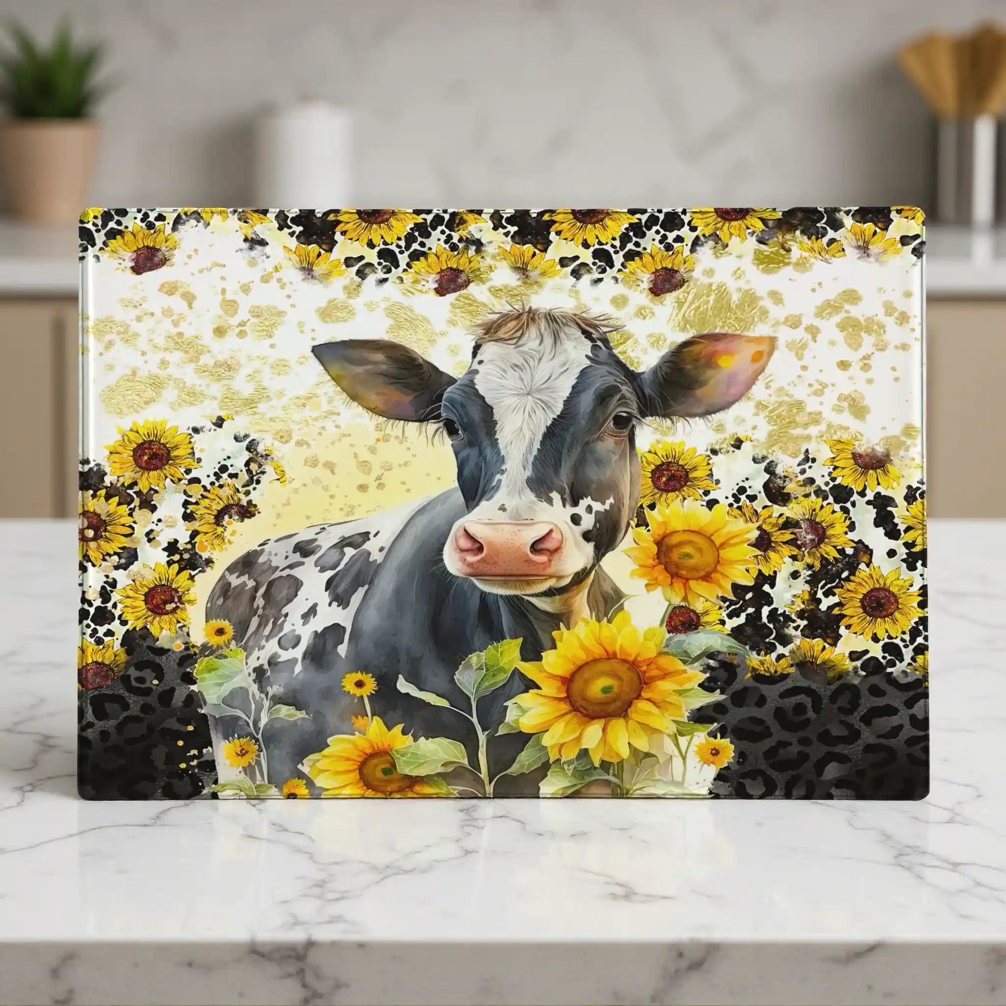 A watercolour cow with bright sunflowers and a leopard print pattern on a glass chopping board from Laser Design Creations