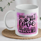 You Can't Buy Love quote ceramic mug by Laser Design Creations, featuring a heartfelt pet rescue message on a pink watercolour background.