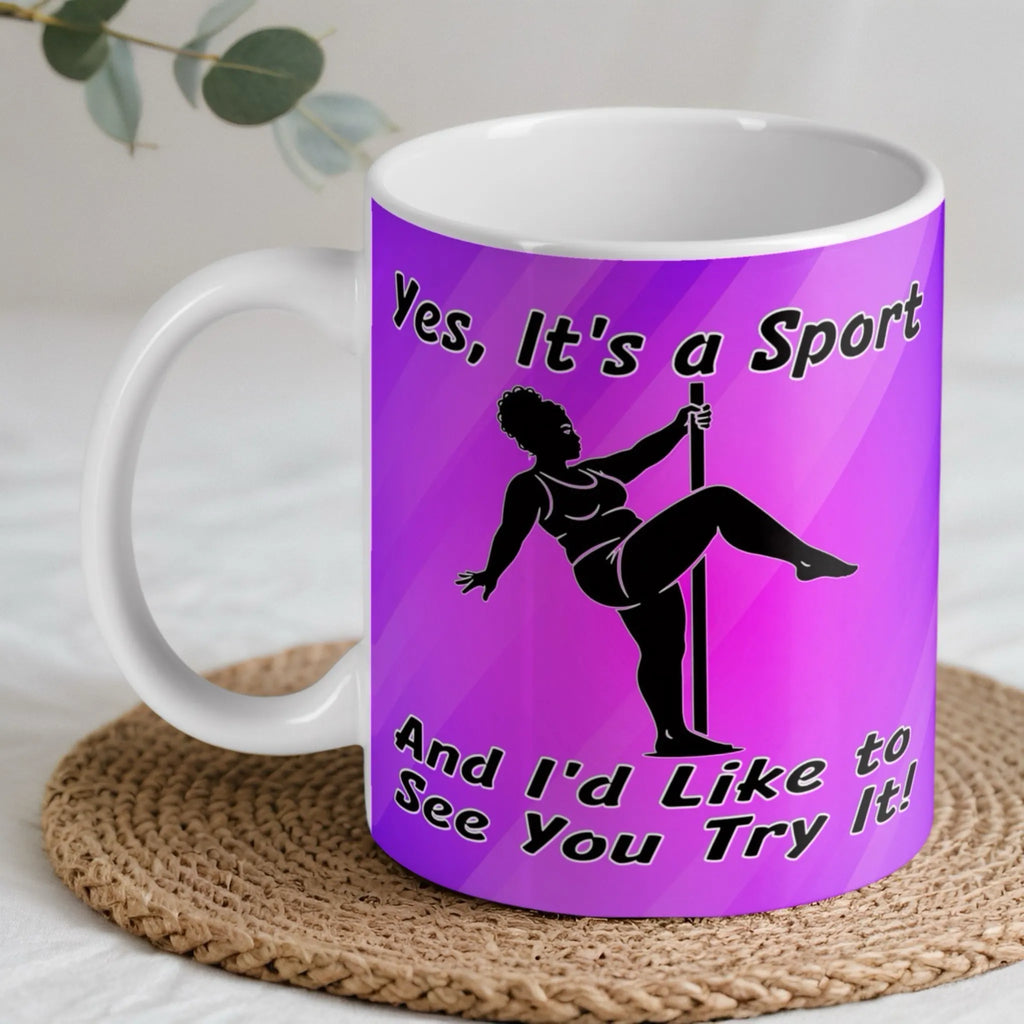 Yes It's A Sport Pole Dancing ceramic mug by Laser Design Creations, featuring a humorous silhouette of a pole fitness dancer against a vibrant purple backdrop with the quote Yes, It's a Sport And I'd Like to See You Try It!.