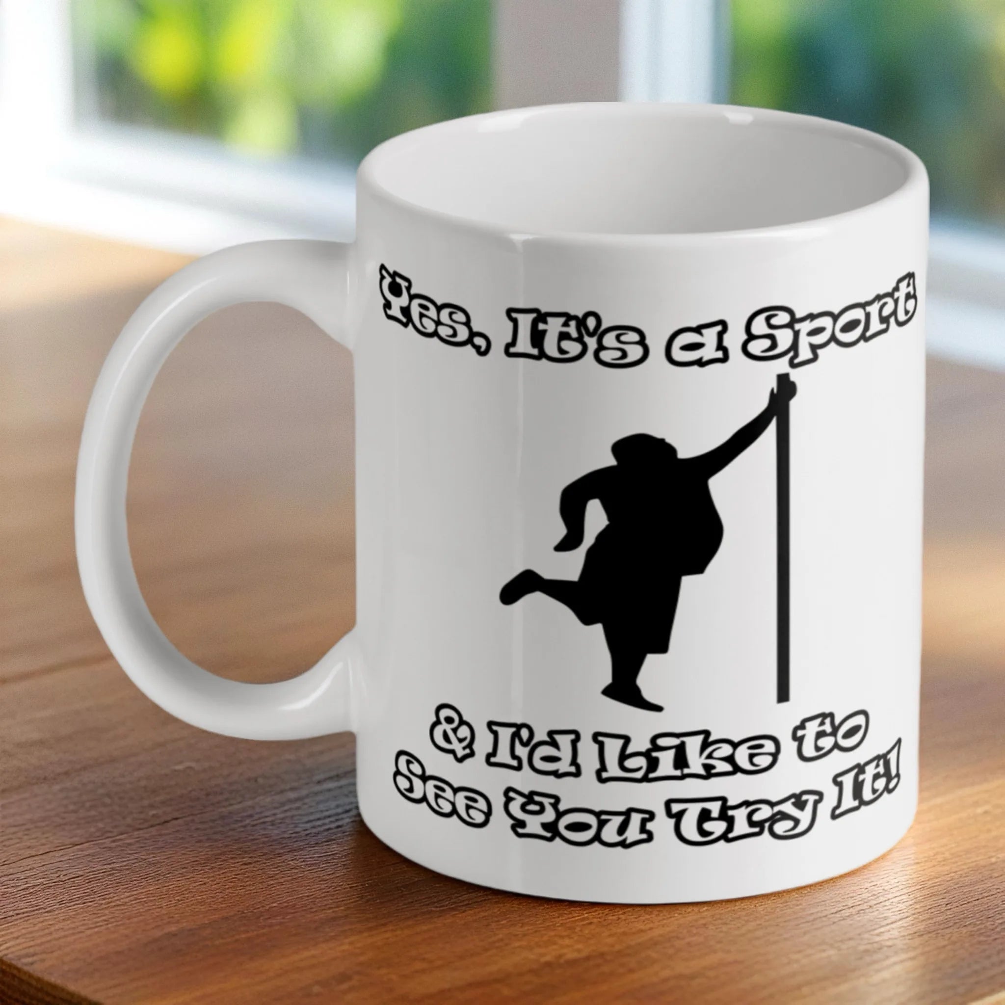 'Yes, It's a Sport & I'd Like to See You Try It!' ceramic mug by Laser Design Creations, featuring a humorous quote and pole dancing silhouette.