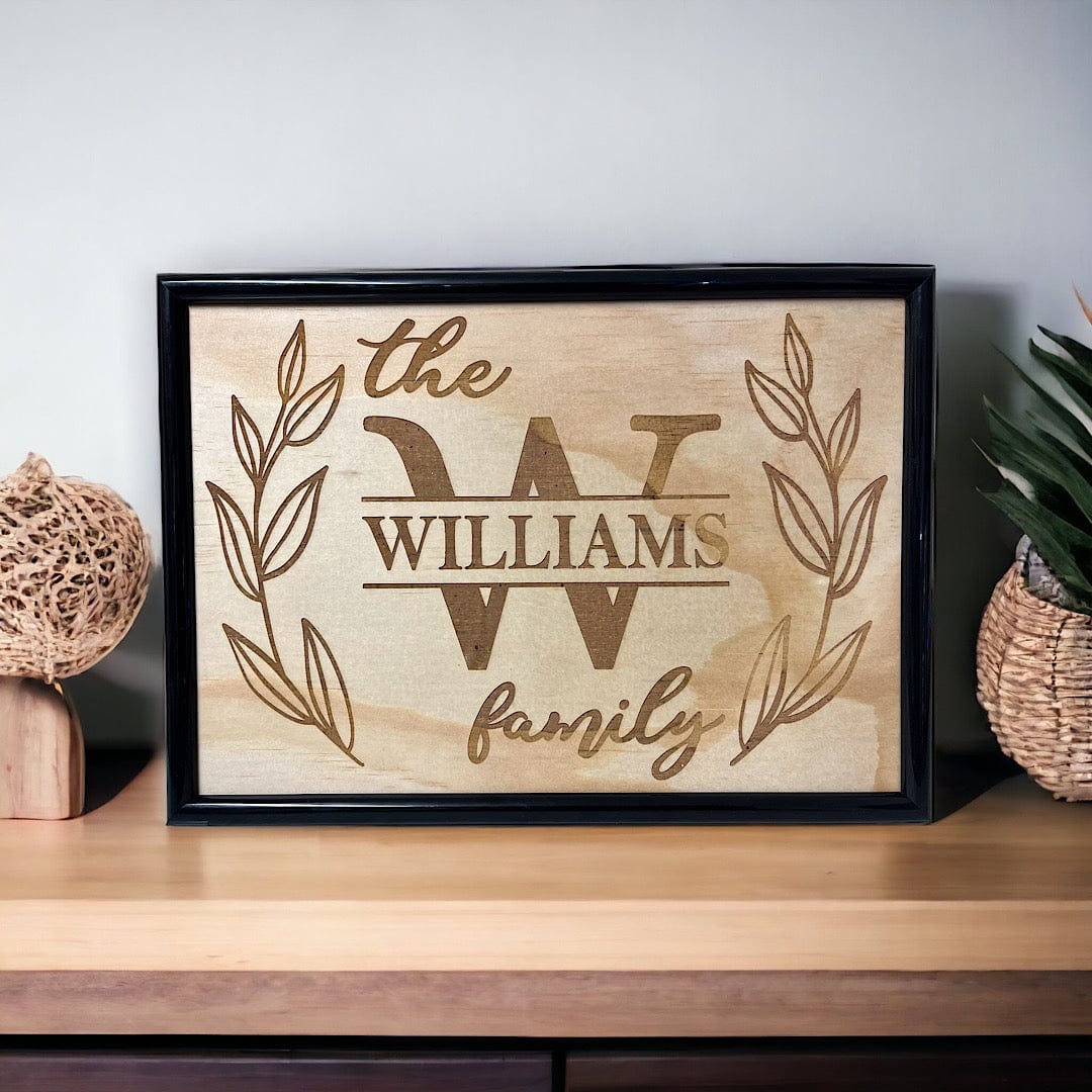 Family name welcome sign wood engraved and displayed on timber table, personalised entryway wall art, Laser Design Creations, Australia.